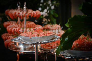salmon tartare, salmon tartare with guacamole, fresh salmon, Japanese food, Japanese cuisine, haute cuisine, salmon ceviche in an ice bowl for an elegant buffet, gourmet salmon tartare served cold on 