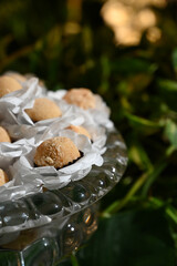 white brigadeiro,elegant handmade sweets for event, floral-style candy arrangement, artisan treats...