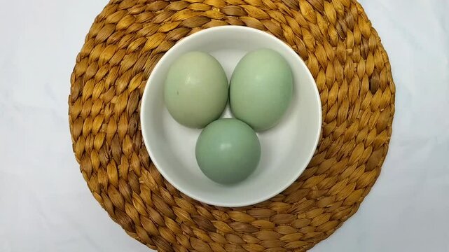 Selective focus. Salted Egg is a traditional dish from Brebes, Central Java, Indonesia. It is made from duck eggs that are salted and then boiled. Footage.