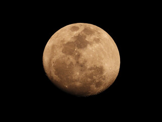 Waxing Gibbous Moon in High Detail Against Black Night Sky.
