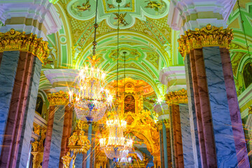 Inside St. Petersburg's Winter Palace, opulent halls boast dazzling chandeliers, gilded columns,...