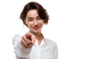 Confident woman pointing at the viewer, dressed in a white blouse with a cheerful expression, isolated on white.