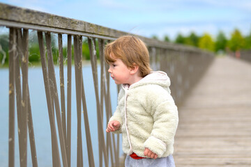 Curious Toddler Looking At Water