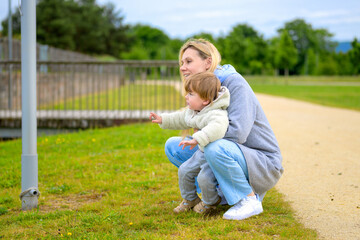 Young Mother Teaching Curious Child
