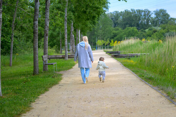 Mother And Child Walking Away