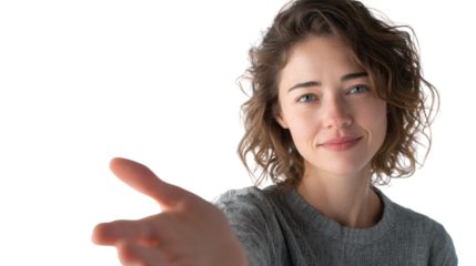 Friendly young woman smiling and reaching out her hand in an inviting gesture, white isolate background.