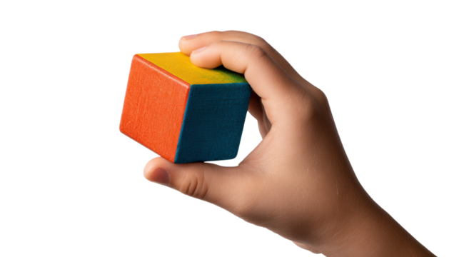 Hand holding a colorful wooden block, ideal for education and play.