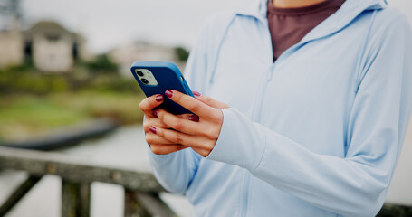 Workout, break and hands with phone on bridge for fitness app, check stats and exercise...