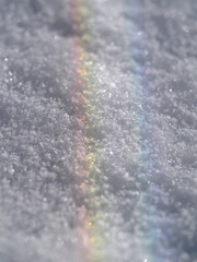Rainbow is reflected in the snow