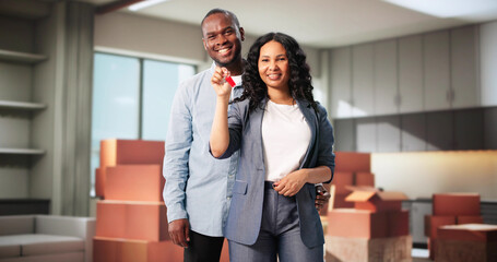 Happy Couple, New Homeowners With Keys, Looking