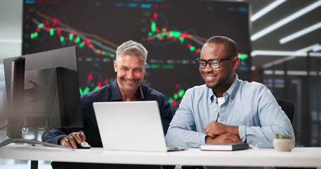 Diverse Group Of Professionals Meeting In Office