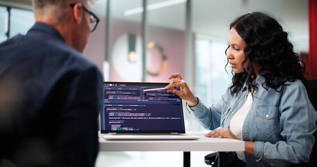 Multiracial Team Of Young Programmers Developing Software