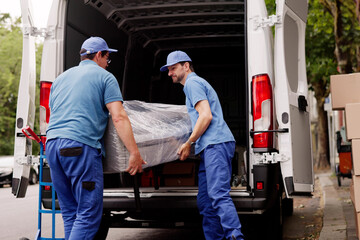 Professional Movers Outside Assisting With Furniture Removal