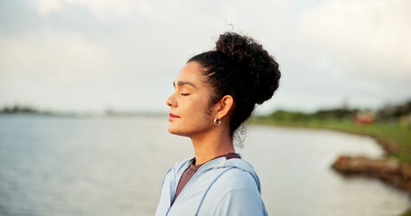Breathing, fitness and meditation with woman at lake in nature for awareness, balance or wellness....