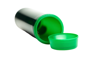 a green container with a lid and a small cup