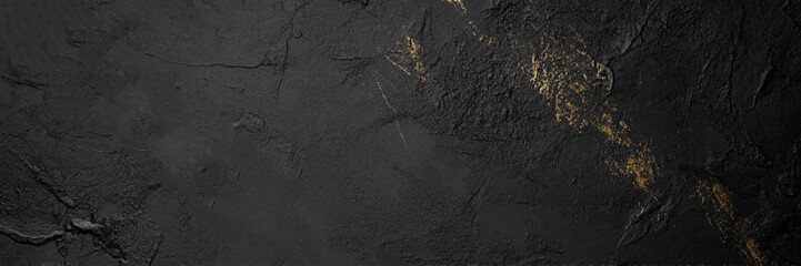 black marble with natural veining patterns. The surface has a deep, dark base colour with subtle, golden streaks and veins that create a striking contrast, use for flooring and exterior design