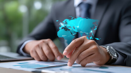 Businessman interacts with digital world map hologram, symbolizing global business and technology integration