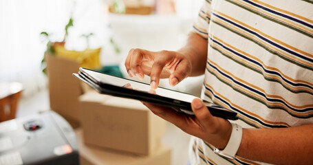 Tablet, moving and hands of man in new home for research on renovations, interior design or online...