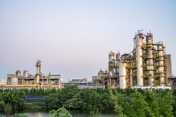 view of oil refinery during sunset