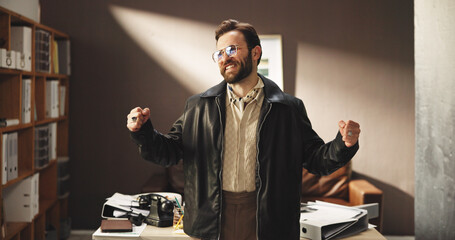 Fashion designer, business man and celebration of success, win or award for retro design. Happy worker, cheering or excited for goal achievement, style or creative prize for vintage clothes in office