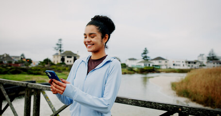 Exercise, break and woman with phone on bridge for fitness app, check stats or running performance....