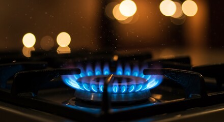 Gas burner actively lit with an intense blue flame, highlighting domestic energy use in a cozy setting.

