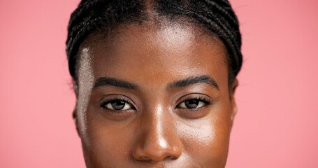 Obraz premium Portrait, eyes and beauty with woman closeup for eyelash treatment, natural aesthetic or microblading. Face, skincare and African model with cosmetics, mascara and lashes on pink studio background
