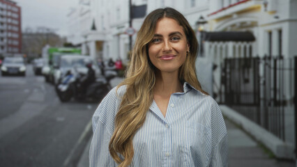 Woman showing hand on chest gesture with closed eyes and smile on city sidewalk; gratitude...