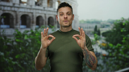 Young man meditating outdoors near the roman coliseum, displaying a calm expression, with lush...