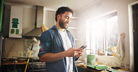 DIY, phone and renovation with man in kitchen of apartment to search for home improvement ideas....