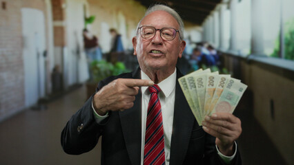 Senior man holding czech koruna banknotes on a restaurant terrace, illustrating business and...