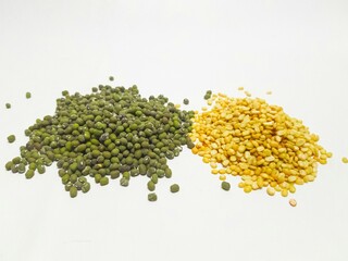 Close-up of split yellow mung beans and whole green mung beans on a white background. Perfect for food, health, and nutrition-related visuals.