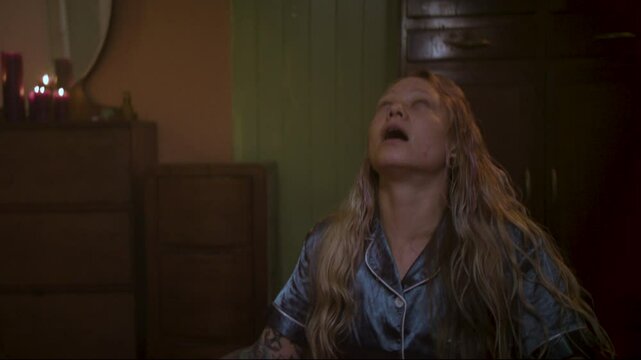 Woman possessed during seance, eyes roll white