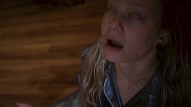 Woman possessed during seance, eyes roll white