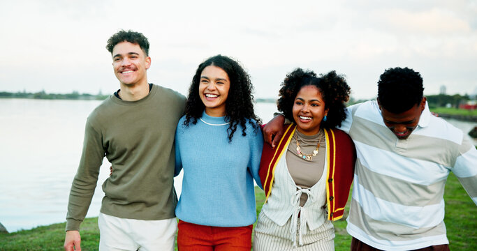 Walking, smile and friends outdoor by lake on vacation, getaway or weekend trip together. Talking, bonding and group of young people in nature for reunion, gathering or catch up on holiday travel.