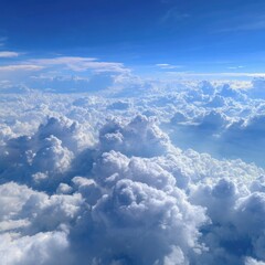 Fototapeta premium A serene view of fluffy white clouds against a clear blue sky.