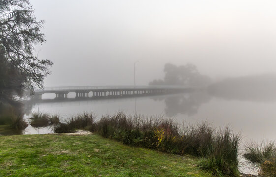 The Riverton Bridge and Canning River in Perth Western Australia on a very foggy morning.