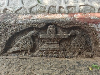 A spiritually resonant view of Thirukazhukundram, Tamil Nadu, India, capturing both the hilltop Vedagiriswarar Temple and the ancient foothill temple complex. The hill temple, dedicated to Lord Shiva,