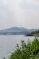 View of N Seoul Tower with Seongsu Bridge and Han river on the fore ground, in Seoul, South Korea