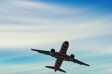 Airplane in the sky, over the cloudy sky , vacation holidays travel tourism

