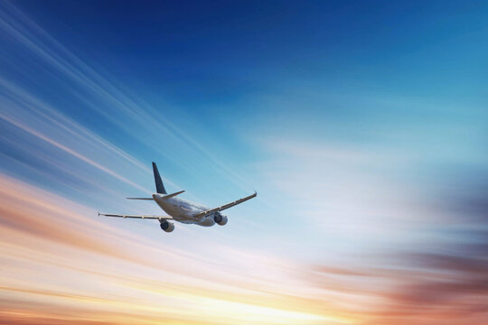 Airplane in the sky, over the cloudy sky , vacation holidays travel tourism

