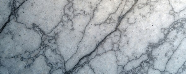 Fototapeta premium Close-up of dark grey marble countertop with uneven textured surface. Small cracks and lines on surface reveal material history. Rich, dark gray hue dominates surface.