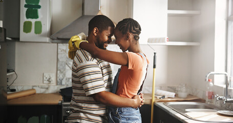 Renovation, dance and black couple hug in home for love, remodeling or bonding together with care....
