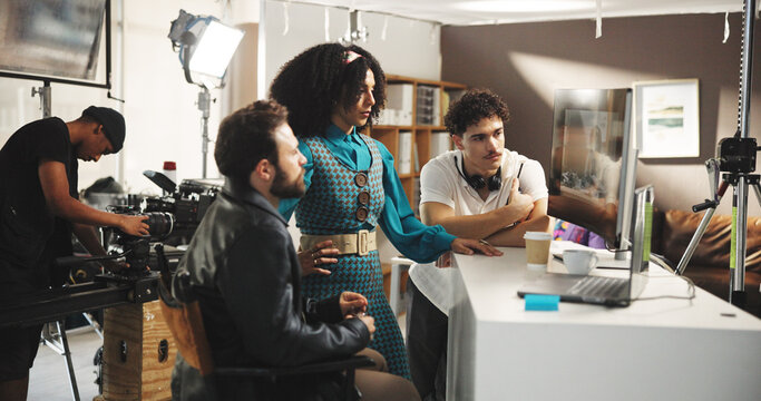 People, director or watching playback with monitor for crew performance, review or retake in studio. Producer, actress and assistant with recording scene for film making, action or production on set - Powered by Adobe