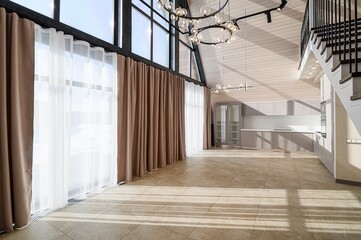 bright interior showcases tall windows with curtains, tile flooring, and kitchen space. Modern...