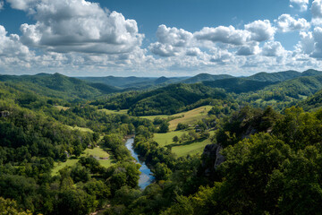 Obraz premium A Majestic Panoramic Vista with Rolling Hills and Serene River Under a Brilliant Azure Sky