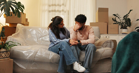 Sad, eviction and couple with boxes in home for foreclosure notice, moving out and lease violation....