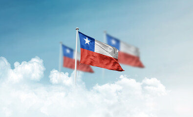 Chile national flags with mast waving in beautiful clouds. Chile flag for Republic Day and...