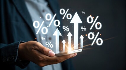 Naklejka premium Rising Percentages Held Above Device Representing Growth and Success with a Business Professional Showing Positive Trends