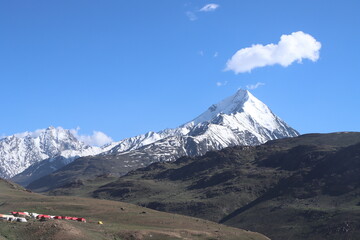 mountain landscape with snow and clouds